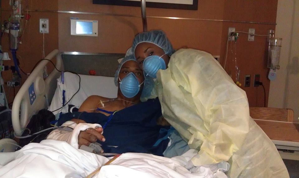 Cedric King in hospital with his wife at his bedside