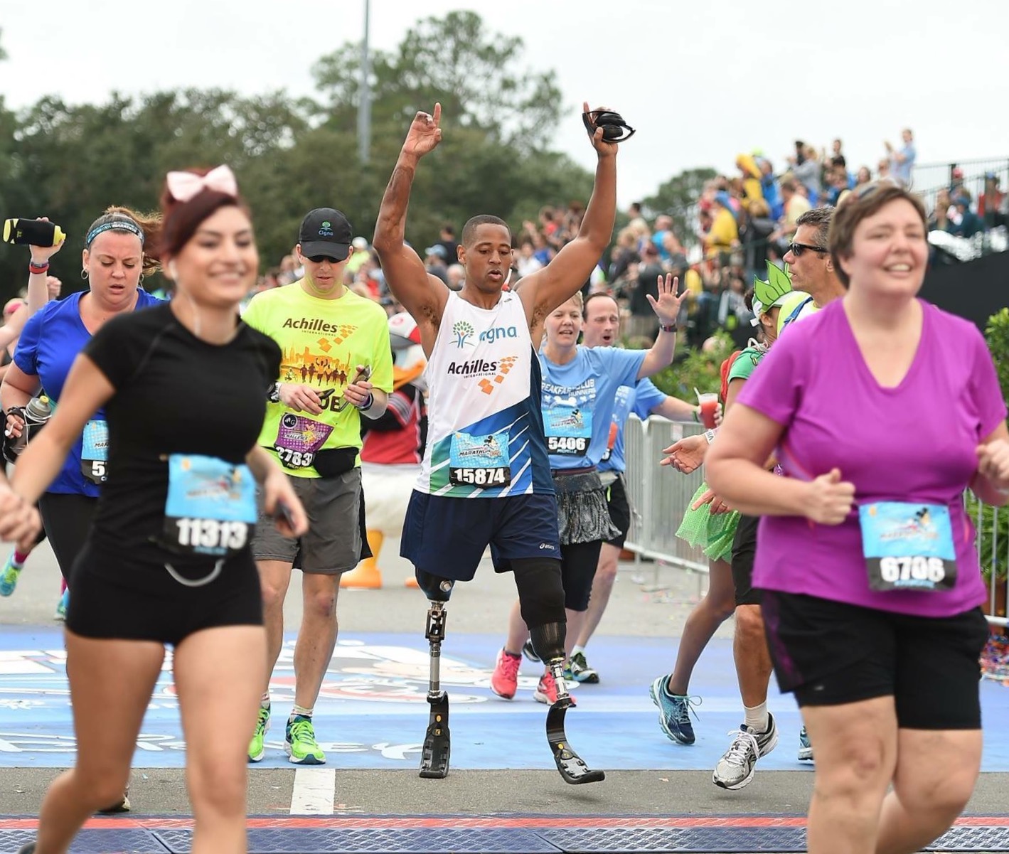 Cedric King finishing a marathon among the crowd