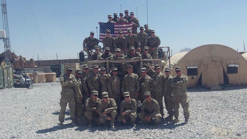 Cedric King's platoon in Afghanistan with the American flag