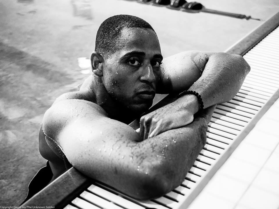 Cedric King at the edge of a rehabilitation pool